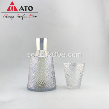 Iridescenccett uppsättning av glas kanna och glasskopp